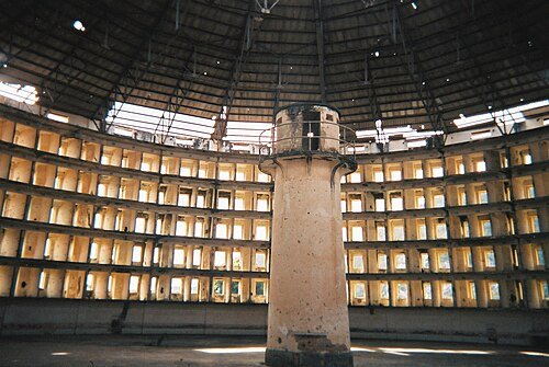 Interior of the Presidio Modelo prison: tiers of cells arranged in a circle around a central guard tower.